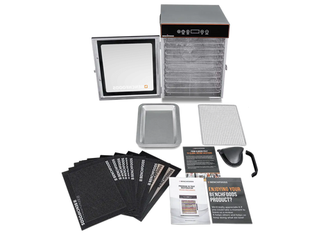 A commercial-grade food dehydrator kit shown on a white background, including the main dehydrator unit with trays, a digital control panel, multiple black dehydrator sheets, a metal tray, a wire rack, a scoop, and instruction manuals.